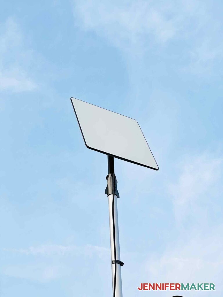 Starlink satellite dish atop a RV flag pole