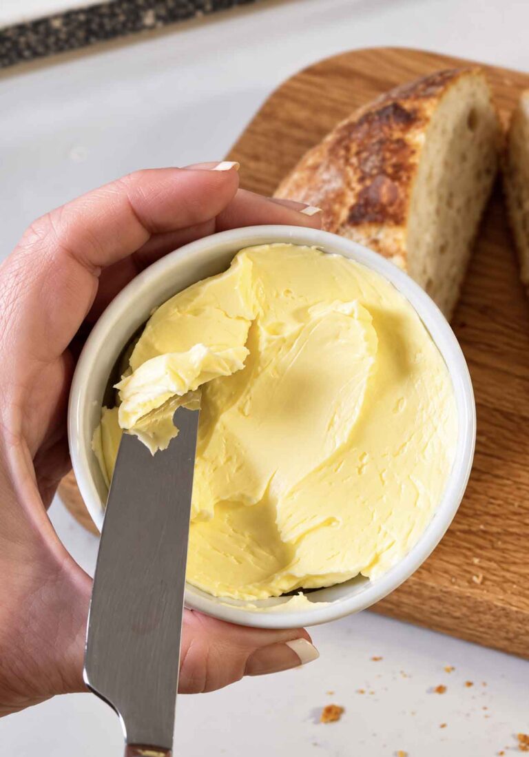 Scooping out some homemade butter for bread