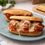 Best meatball subs on a blue plate