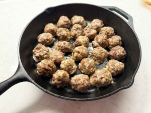 Browning meatballs in cast iron skillet