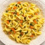 creamy chicken soup in a white bowl
