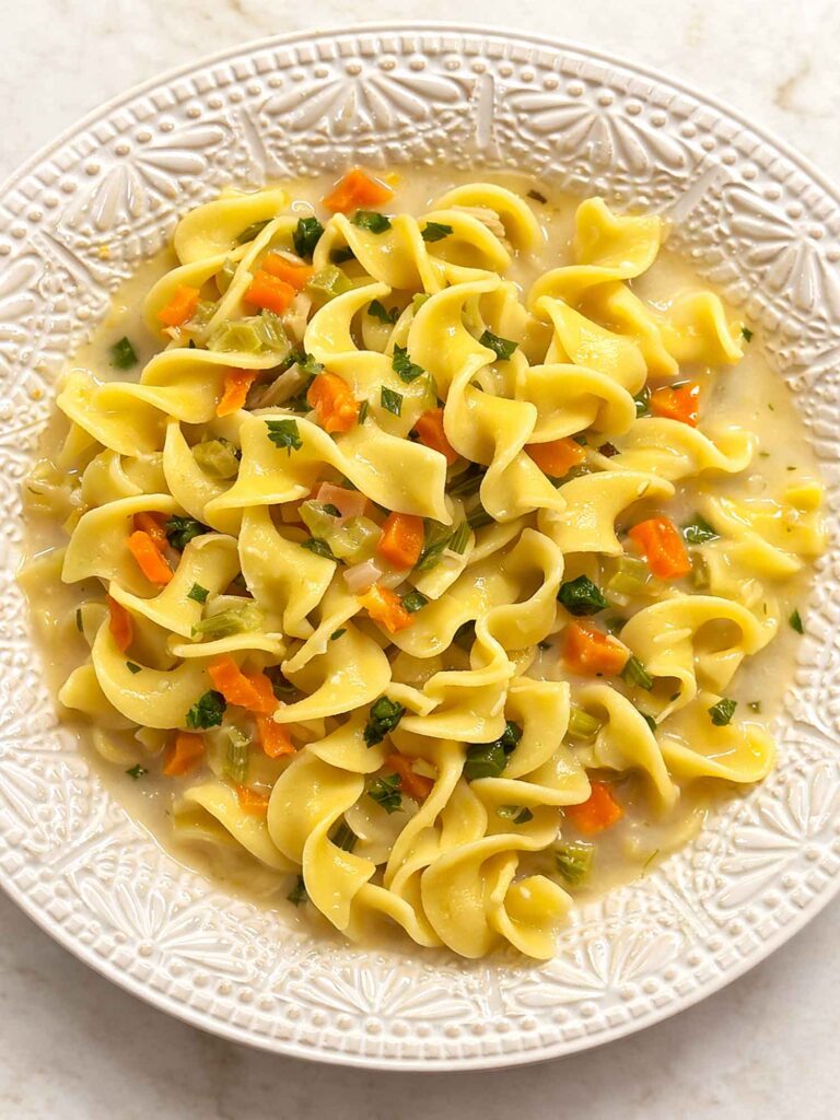 creamy chicken soup in a white bowl