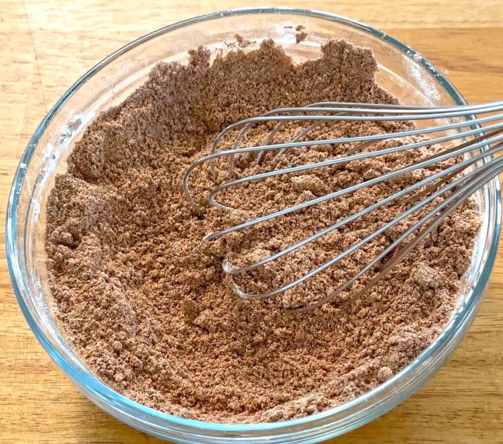 Mixing taco seasoning ingredients in a bowl