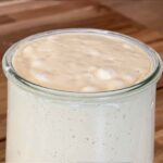 Sourdough starter bubbling and active