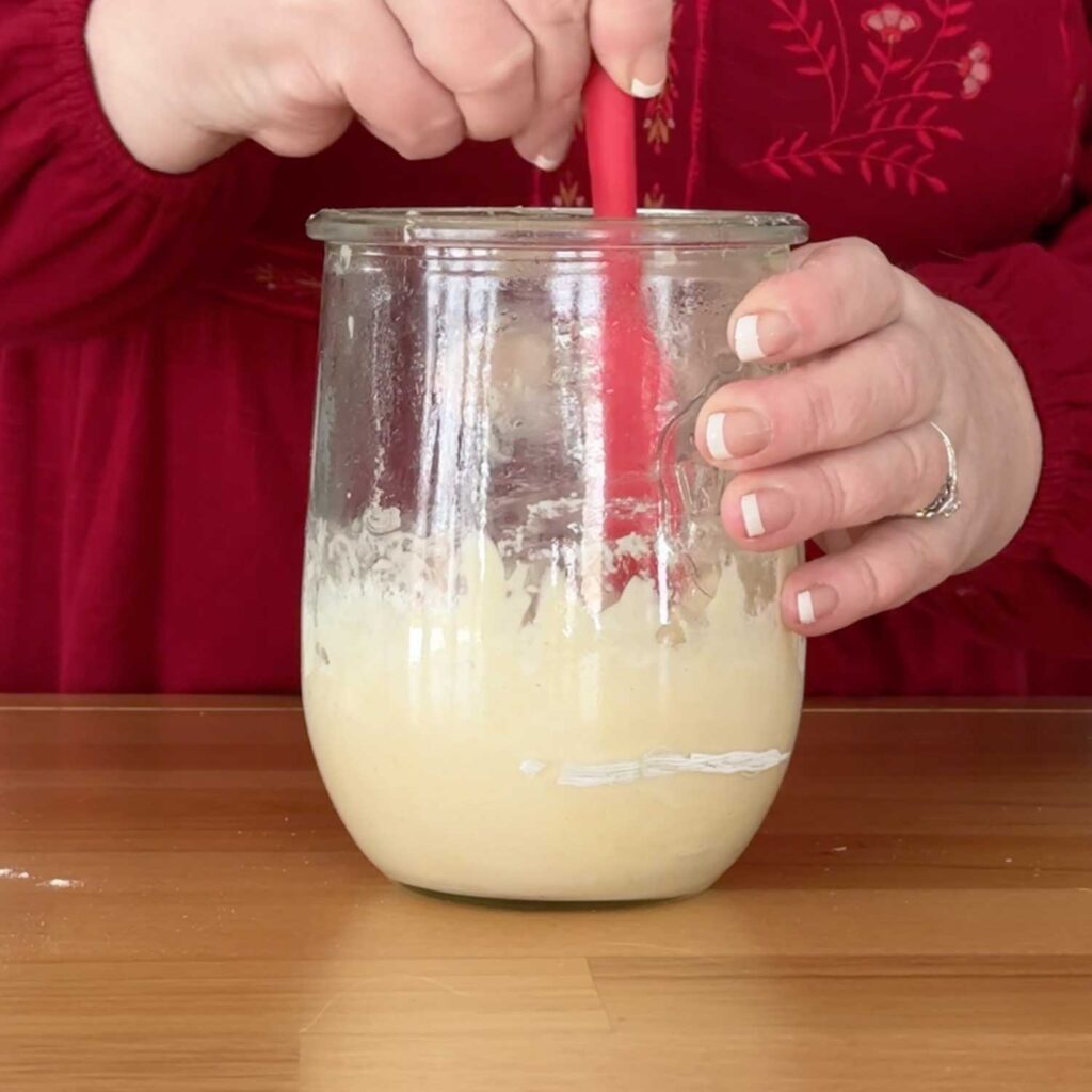 Stirring the sourdough starter mix
