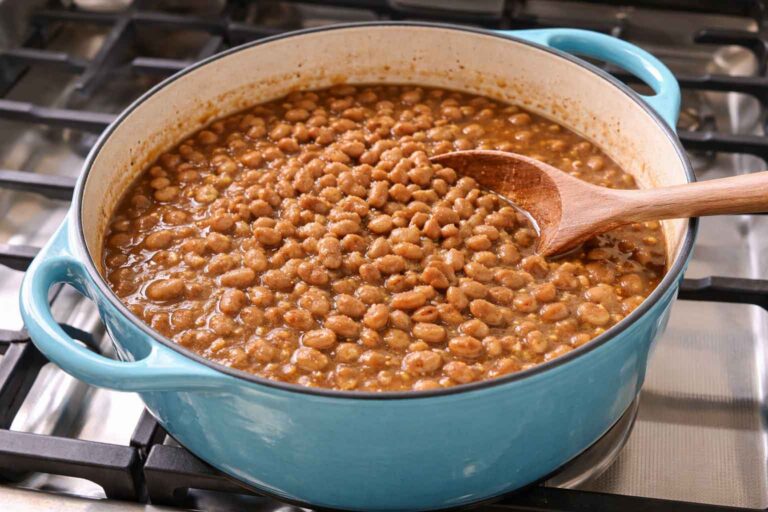 Brown Beans made with pinto beans in a blue dutch oven on the stove
