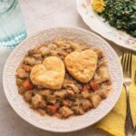 Chicken Pot Pie casserole without crusts, two heart-shaped biscuits on top