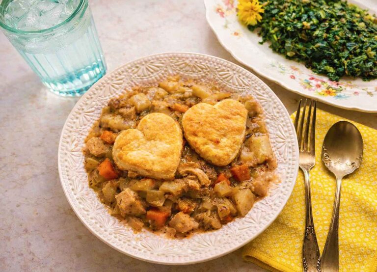Chicken Pot Pie casserole without crusts, two heart-shaped biscuits on top