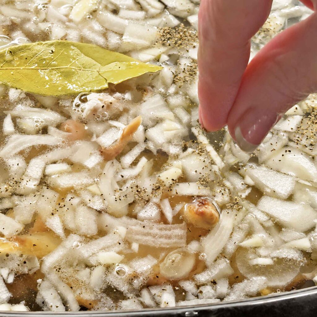 Adding seasonings to chicken stock