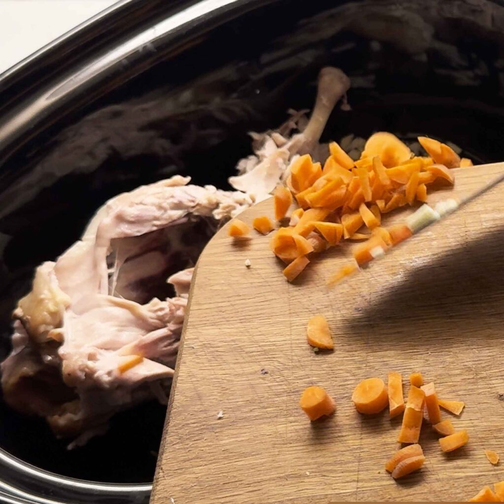 Adding vegetables to bones in slow cooker