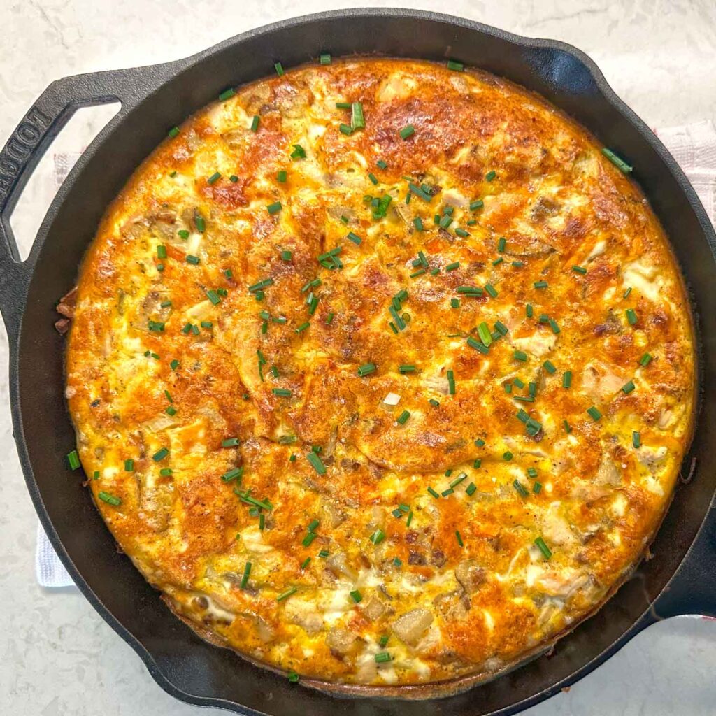 Egg and potato casserole in a cast iron skillet