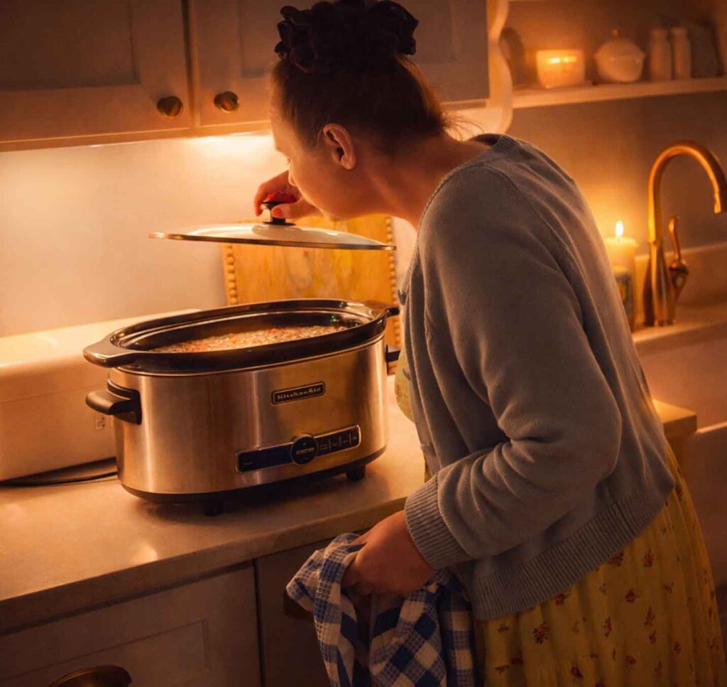 Jennifer making chicken stock in her slow cooker in the kitchen