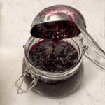 Pouring jam into a jar