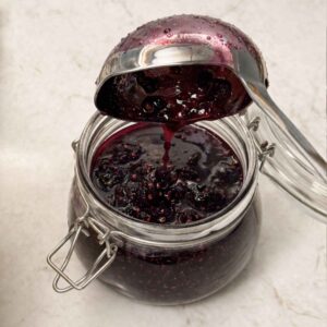 Pouring jam into a jar