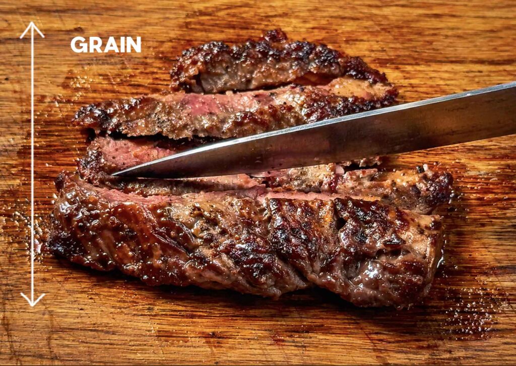 cutting skirt steak across the grain