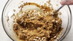 Stirring oats into wet ingredients