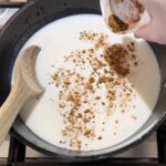 Adding cinnamon to rice pudding