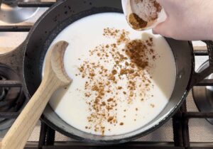 Adding cinnamon to rice pudding