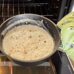 Putting rice pudding into the oven