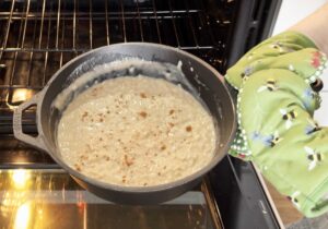 Putting rice pudding into the oven