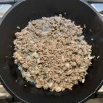 ground beef and onions in pot