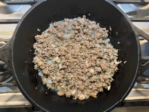 ground beef and onions in pot