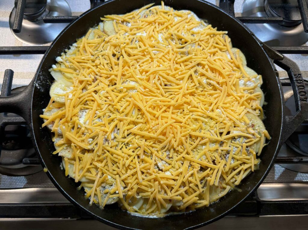 cheese on top of the potatoes