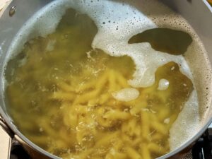 Cooking penne pasta in boiling water