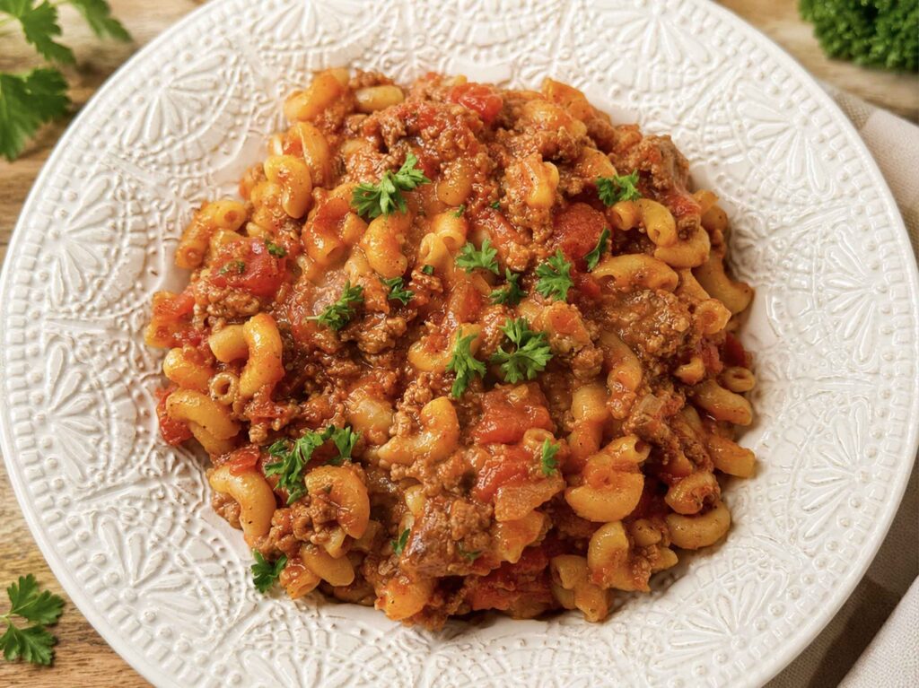 American goulash in a white ceramic bowl