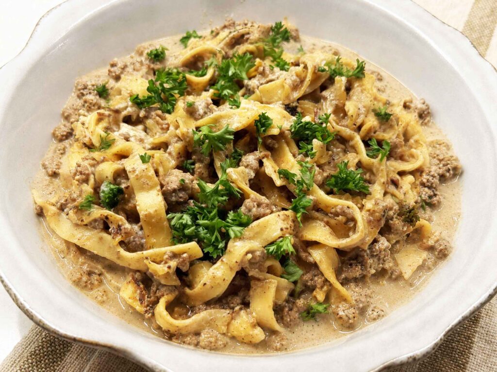 Ground beef stroganoff in a white bowl