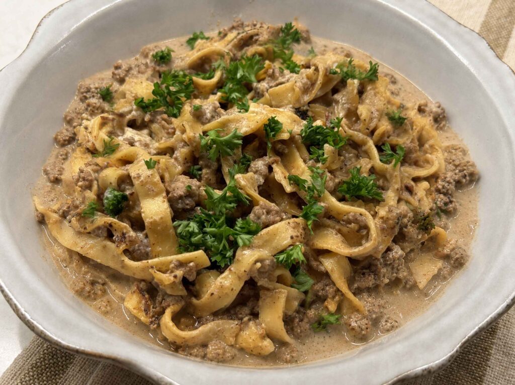 Ground beef stroganoff in a white bowl