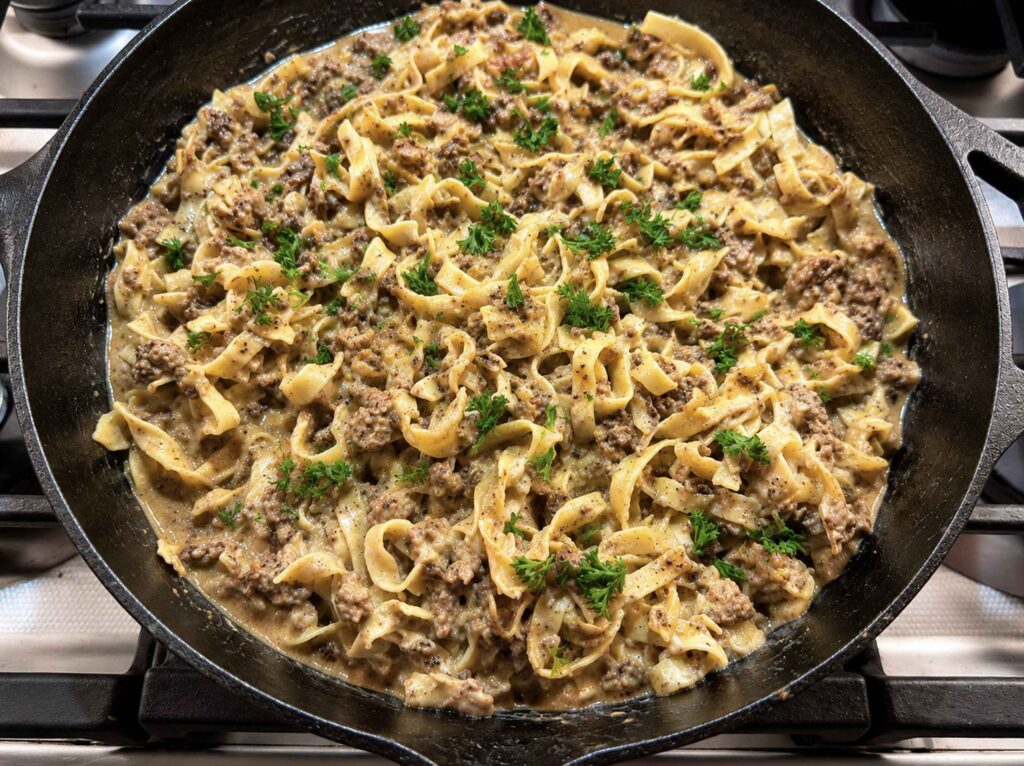 Ground beef stroganoff in a cast iron skillet