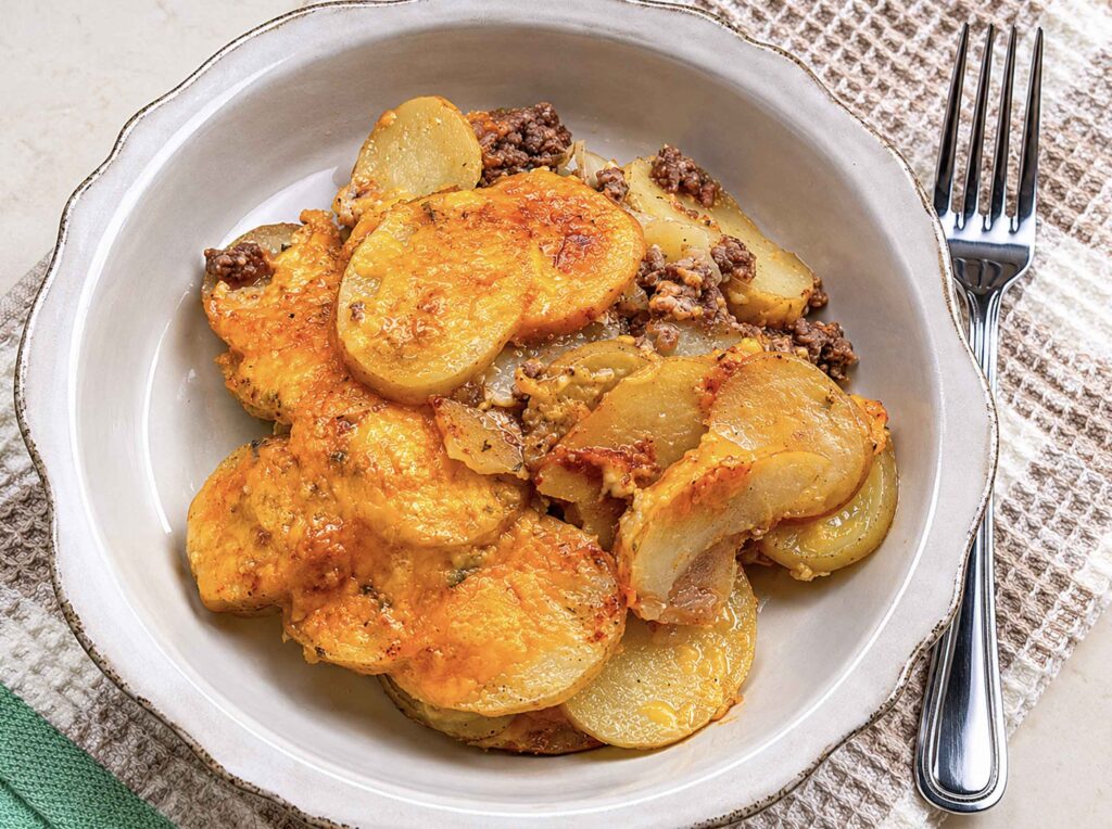 Hobo casserole in a bowl with a fork