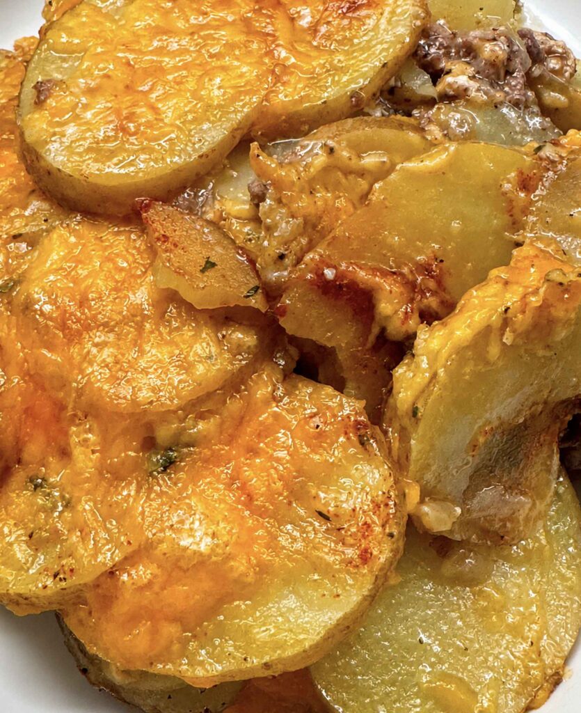 Closeup of cheesy hobo casserole on a plate