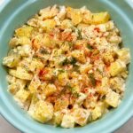 Creamy old fashioned potato salad in a blue bowl