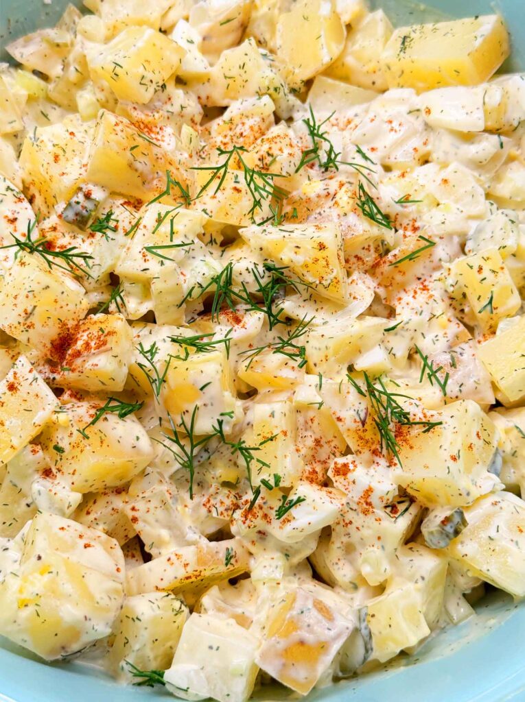 Potato salad with dill and paprika on top