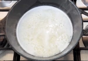 Rice gently boiling in pot