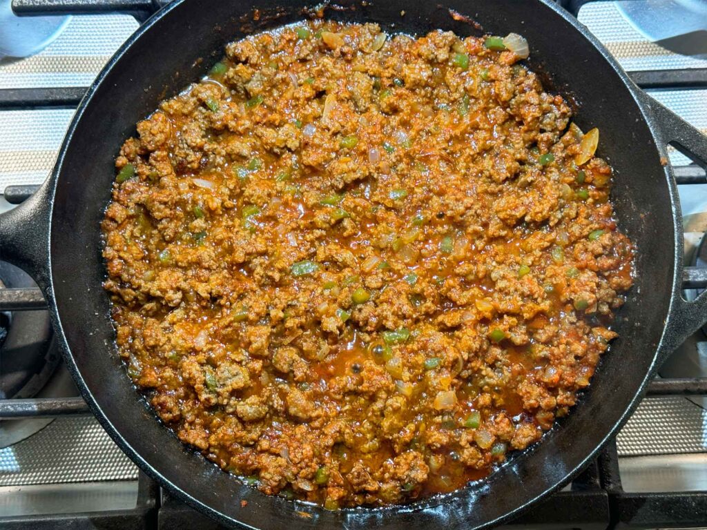 Sloppy joe ground beef mixture in cast iron skillet