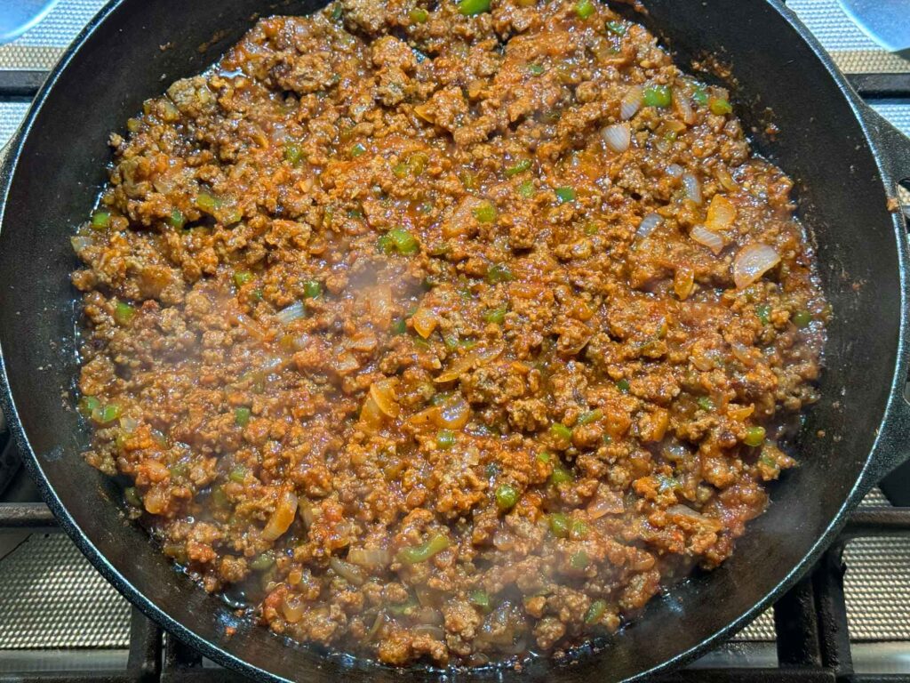 Simmering the sloppy joe mixture in a skillet