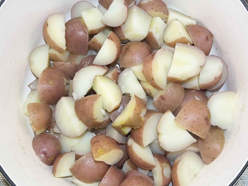 Boiled potatoes returned to the pot