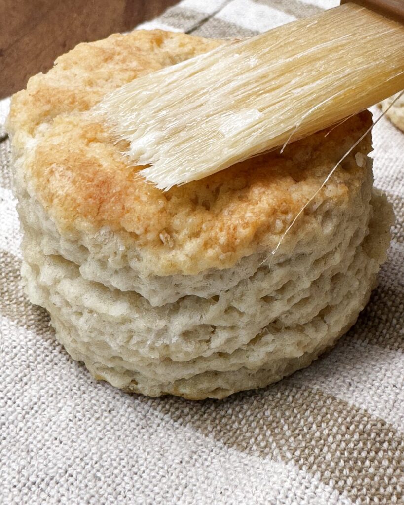 Brushing biscuits with butter