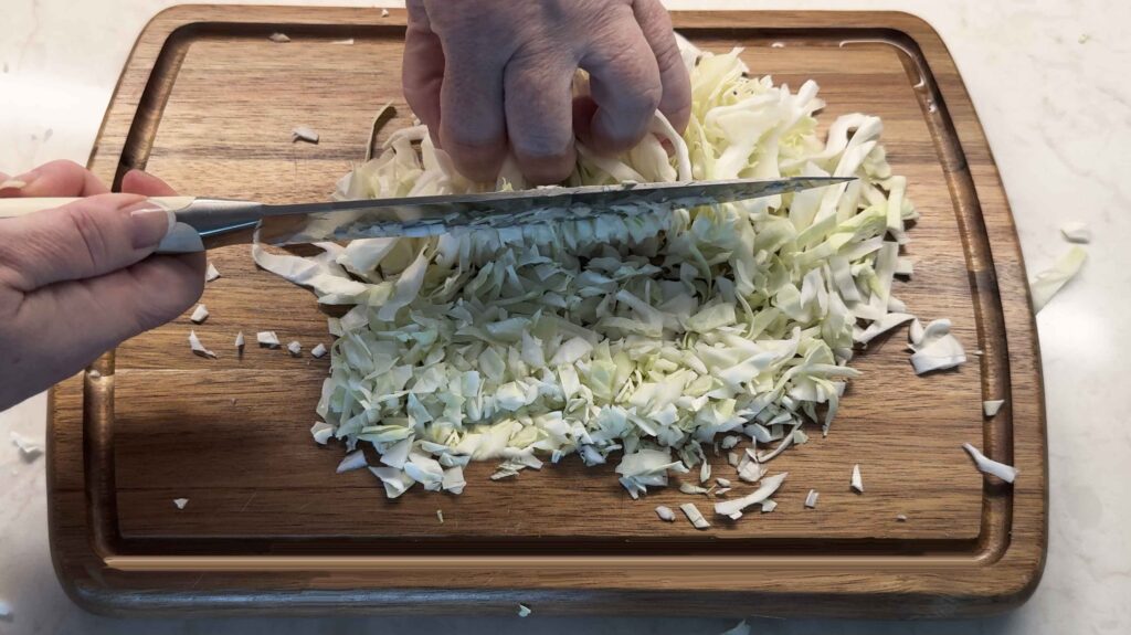 Chopping cabbage into small pieces