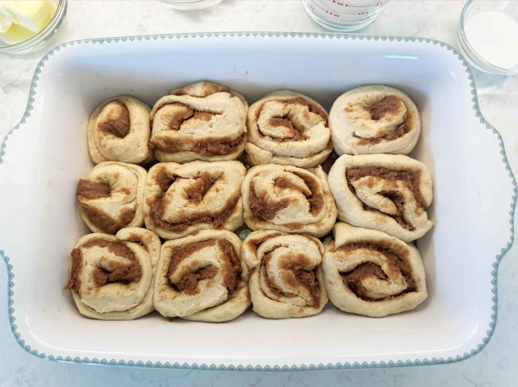 Cut cinnamon rolls in a greased baking dish after two hours at room temperature