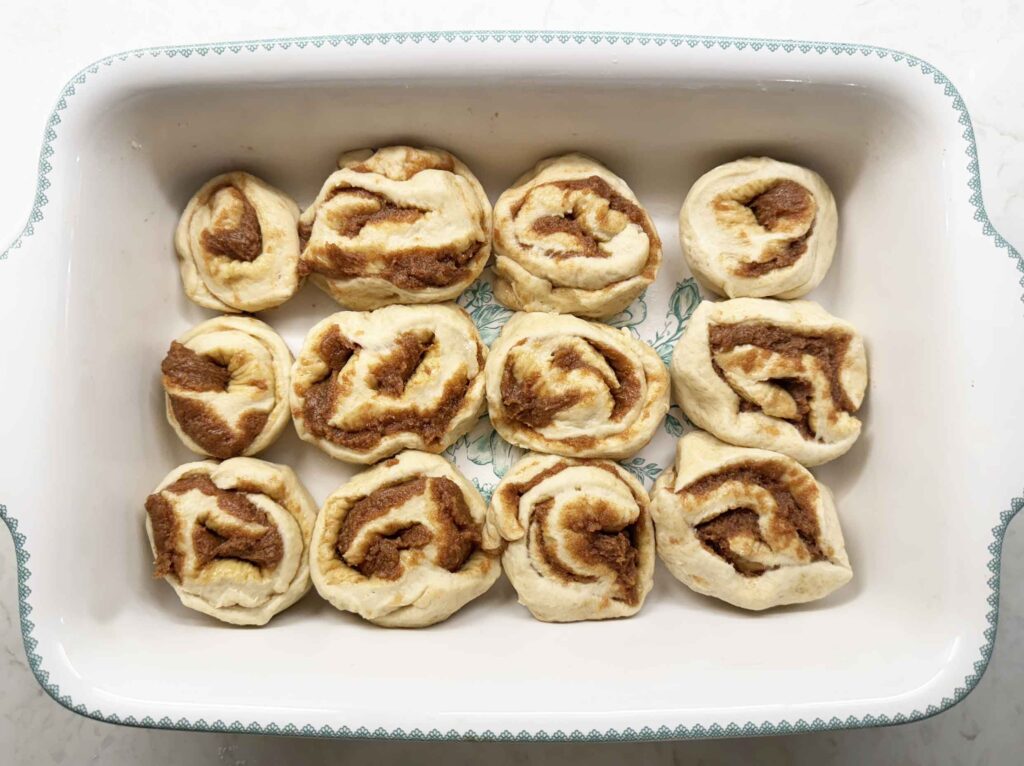 Cut cinnamon rolls in a greased baking dish