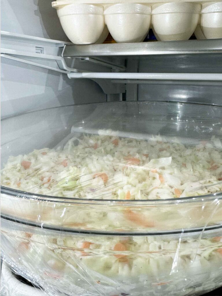 Coleslaw covered in refrigerator