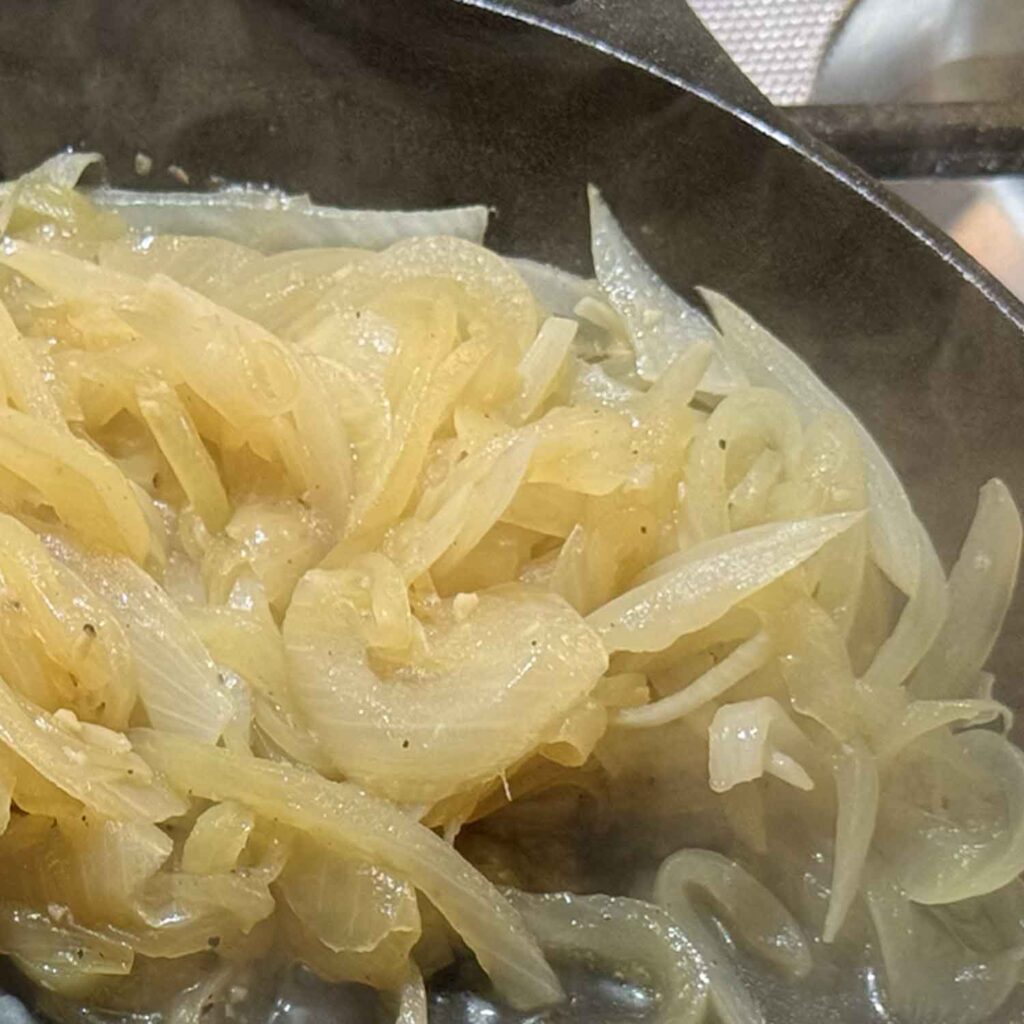 Cooking onions down to reduce liquid