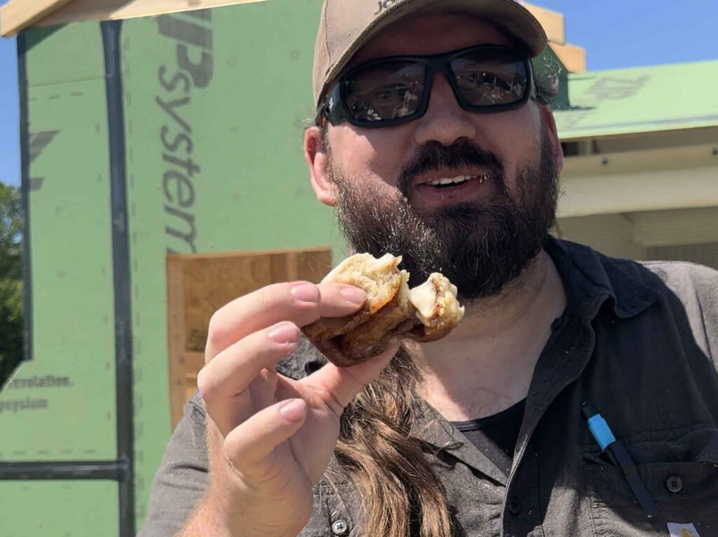Greg enjoying a sourdough cinnamon roll