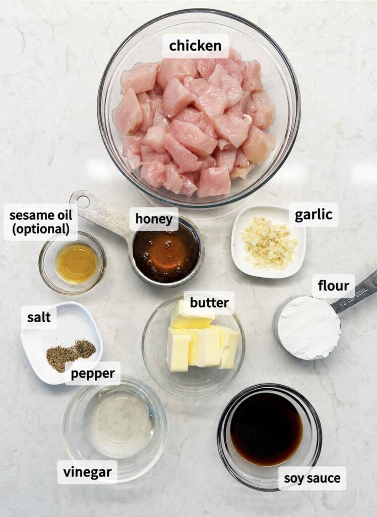 Ingredients in bowls and measuring cups for honey garlic chicken