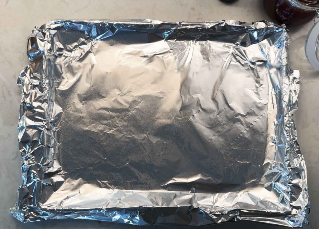 Lining a baking sheet with foil