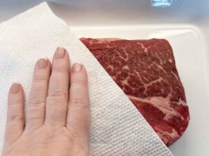Patting the beef dry